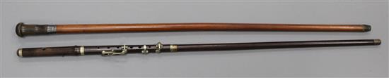 A rosewood walking stick with flute handle, 34.5in.